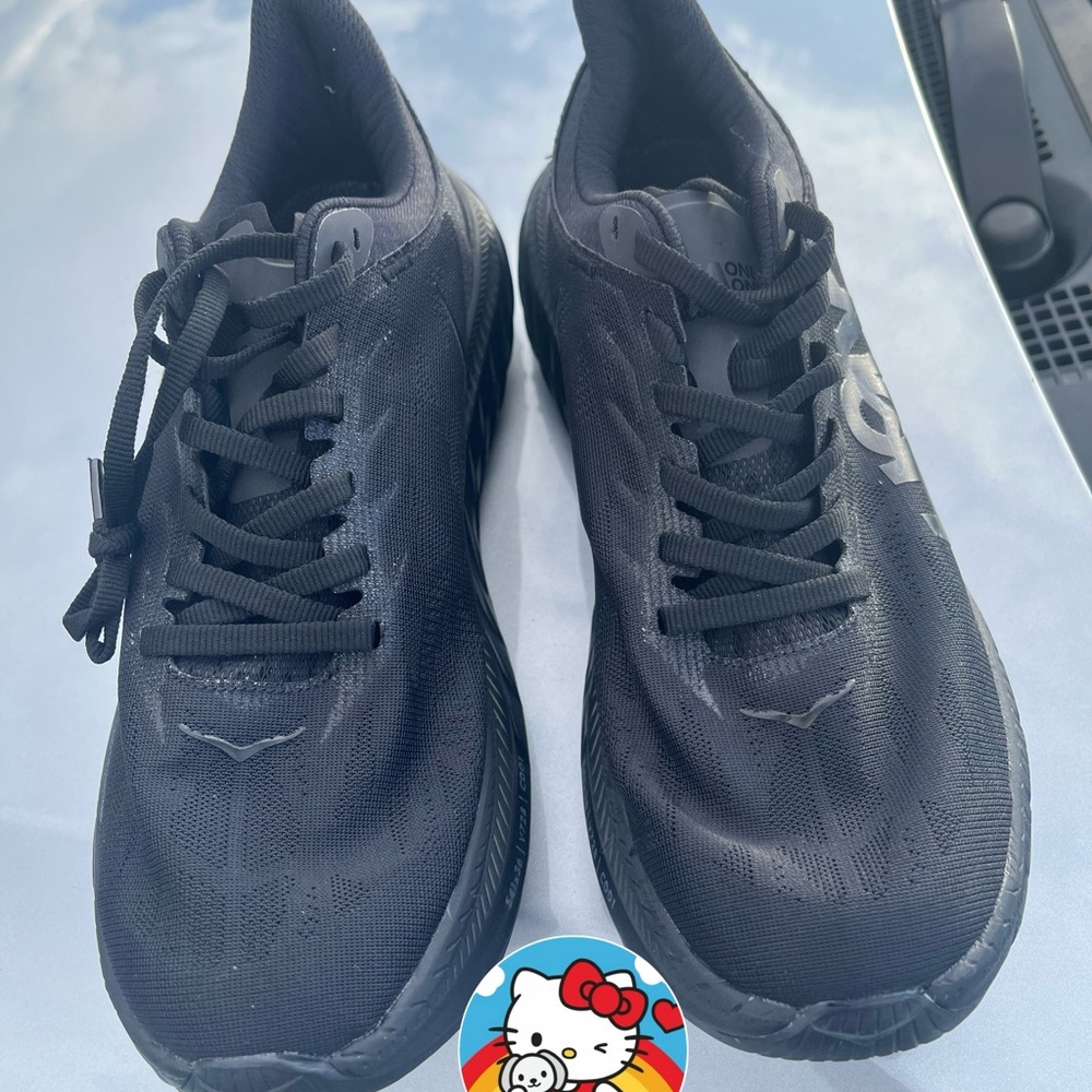 New Hoka sneakers; never worn. Comes with a free pair of Nike ankle socks